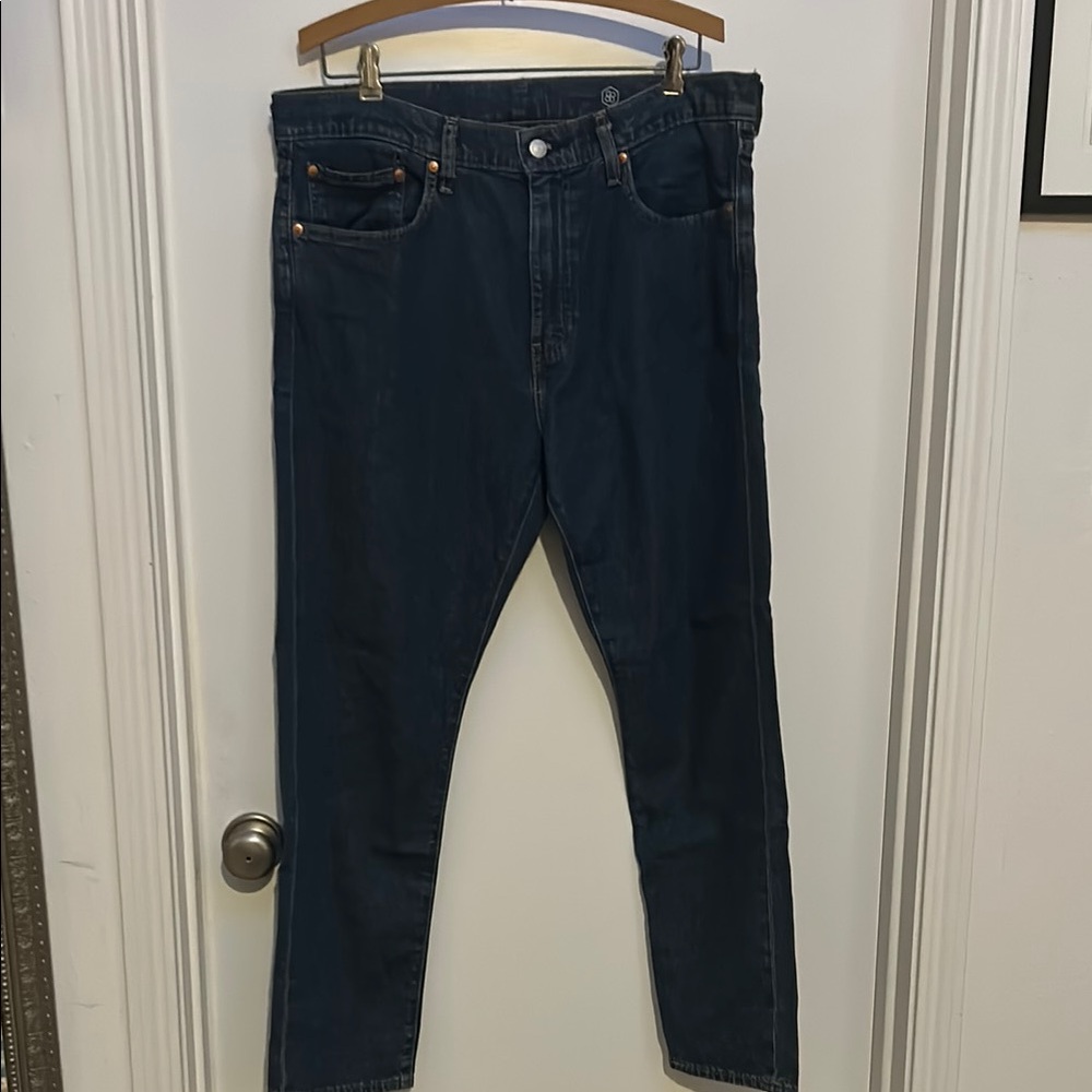 Levi’s 512 strait leg dark wash Blue Jeans marked irregular (run small 34/30)